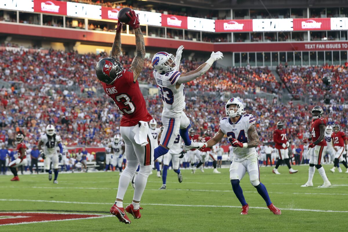 Tampa Bay Buccaneers receiver Mike Evans reaches high for a touchdown catch.