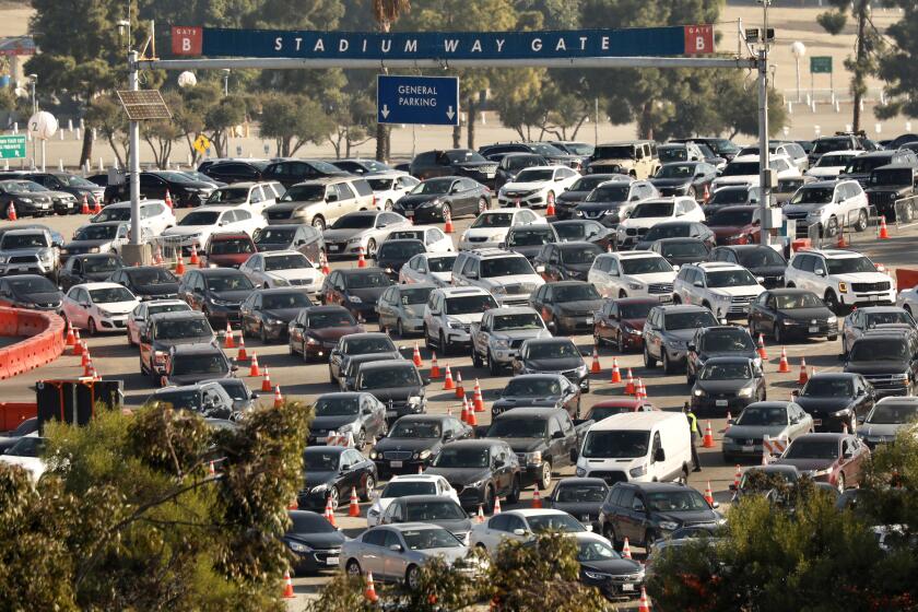 LOS ANGELES, CA JANUARY 4, 2021 - The Dodger Stadium COVID-19 testing site, which is the largest in the U.S., reopened Monday, January 4, 2021, after a weekend closure for restructuring to alleviate traffic in the area. (Al Seib / Los Angeles Times)
