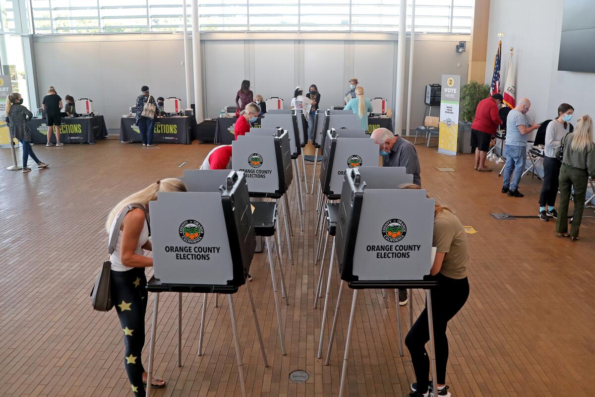 Voters make their ballot selections on Election Day at Newport Beach Civic Center on Tuesday.