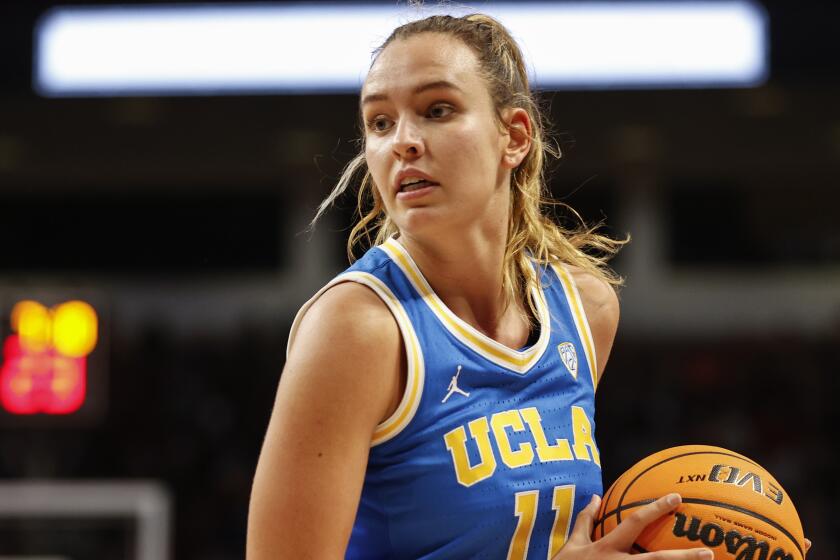 UCLA forward Emily Bessoir looks to pass against South Carolina during the first half.
