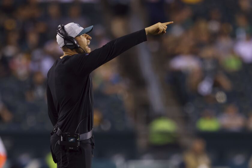 FILE - Philadelphia Eagles linebackers coach Nick Rallis gestures during a preseason NFL football game against the Pittsburgh Steelers, Thursday, Aug. 12, 2021, in Philadelphia. It's a big weekend for Nick Rallis and big brother Mike. Mike Rallis, better known as WWE star Madcap Moss, is in the mix for Saturday's Royal Rumble. (AP Photo/Rich Schultz, File)