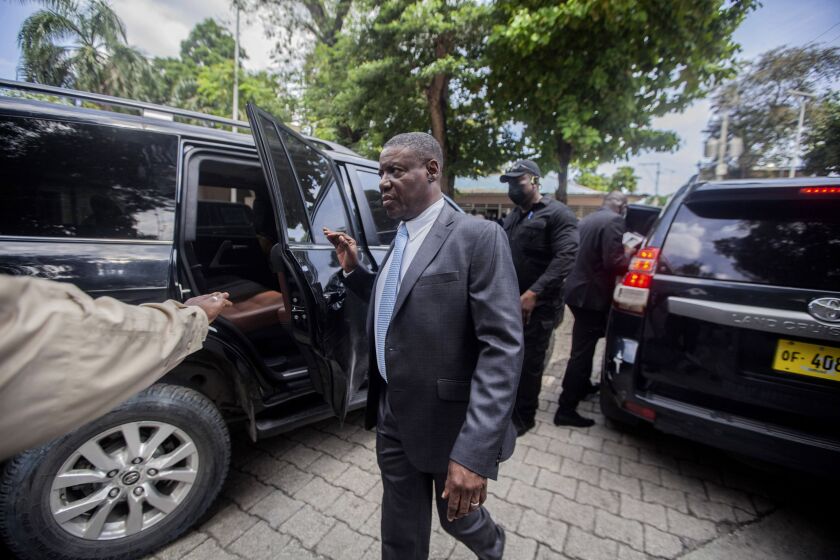 Haiti's newly-named Justice Minister Liszt Quitel, leaves after he was installed in office, in Port-au-Prince, Haiti, Thursday, Sept. 16, 2021. (AP Photo/Richard Pierrin)