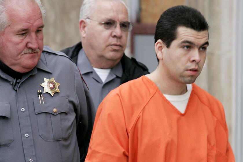 FILE - Anthony Sanchez, right, is escorted into a Cleveland County courtroom for a preliminary hearing, Feb. 23, 2005, in Norman, Okla. On Thursday, Sept. 21, 2023, Oklahoma plans to execute Sanchez for the 1996 slaying of a University of Oklahoma dance student in a case that went unsolved for years. Sanchez, 44, is scheduled to receive a lethal injection at 10 a.m. at the Oklahoma State Penitentiary in McAlester, Okla. (Jaconna Aguirre/The Oklahoman via AP, File)