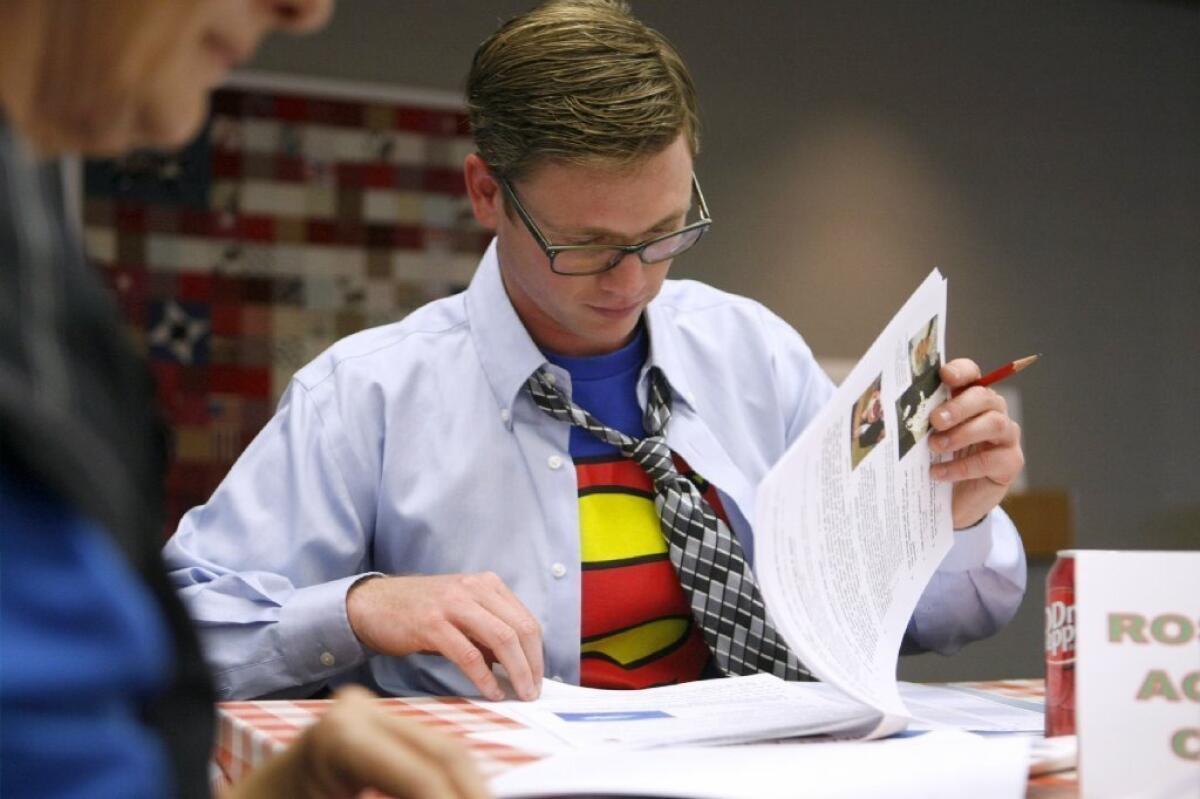 Dressed in a Superman T-shirt, Tim Unger from the Rose Bowl Aquatics Center participates in the Verdugo Hills Hospital's annual trivia fundraiser,