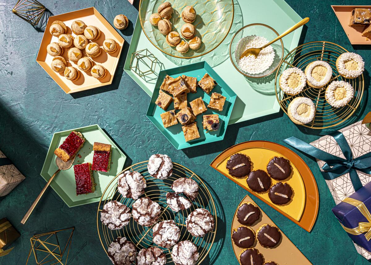 A spread of holiday cookies on plates