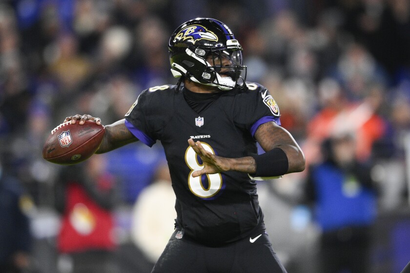 Baltimore Ravens quarterback Lamar Jackson looks to pass against the Cleveland Browns during the first half of an NFL football game, Sunday, Nov. 28, 2021, in Baltimore. (AP Photo/Nick Wass)
