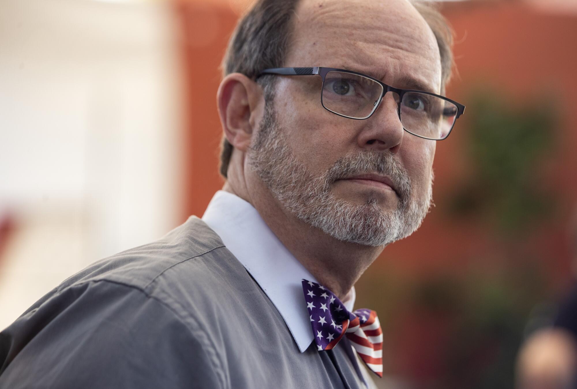 A man in a U.S. flag bow tie