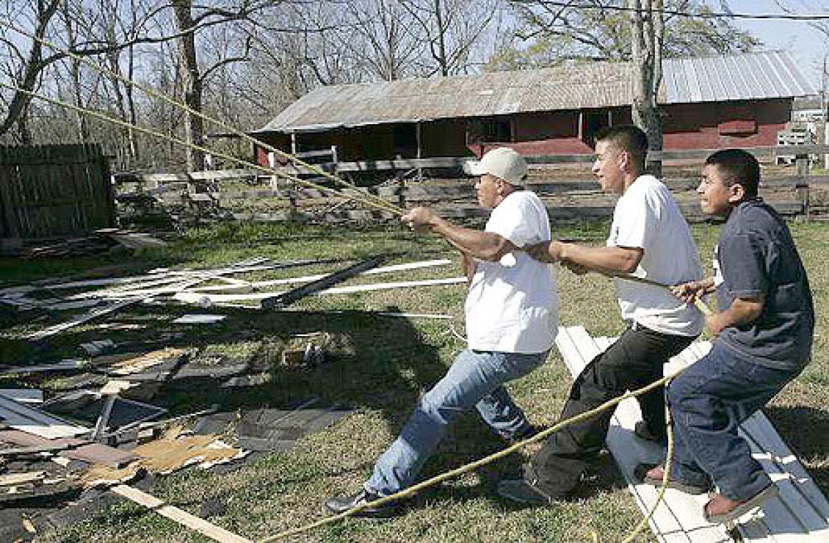 DEMOLITION MEN: Juan Silvino Sanchez, Juan Cogco and Santo DeJesus are among the thousands of Mexicans who came to New Orleans for construction jobs after Hurricane Katrina. We really didnt know where it was, said one man who left Mexico for the work.