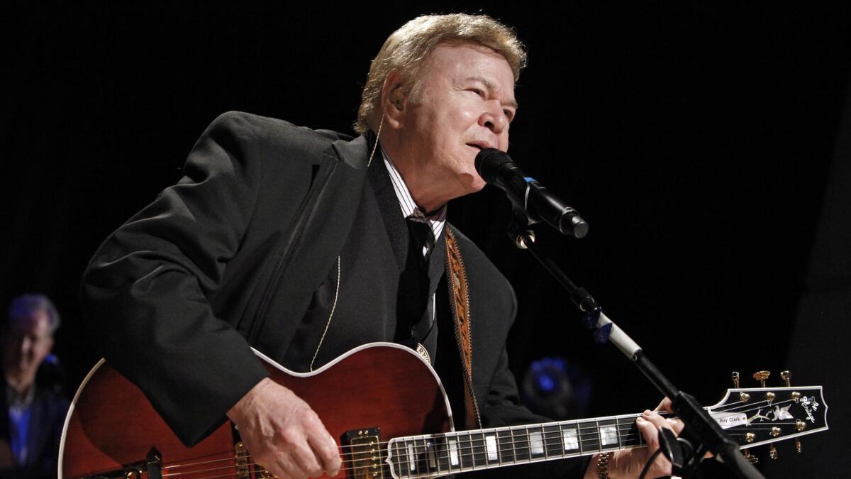 Roy Clark performs after being inducted into the Country Music Hall of Fame in Nashville on May 17, 2009.