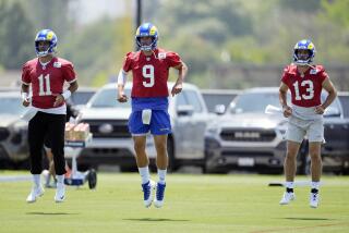 Los Angeles Rams quarterback Jimmy Garoppolo, left, Matthew Stafford, center, and Stetson Bennett warm up.