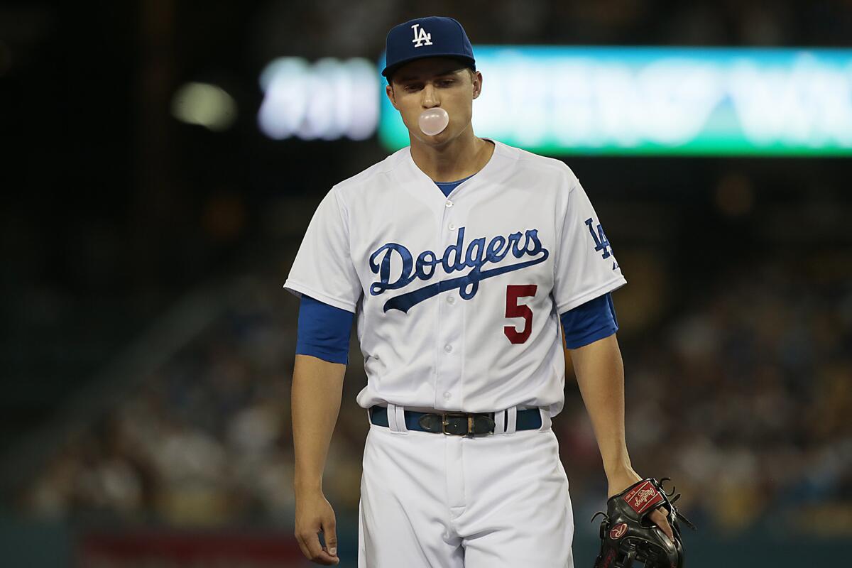 Dodgers third baseman Corey Seager blows a bubble while waiting for the next pitch as he plays defense against the Diamondbacks.