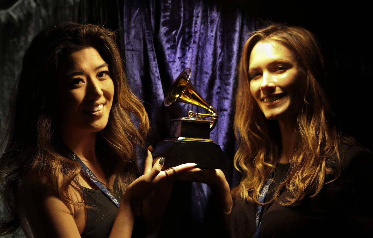 Jennifer Lee, left, and Kyna Treacy, trophy presenters for the Grammy Awards, at Staples Center on Friday.