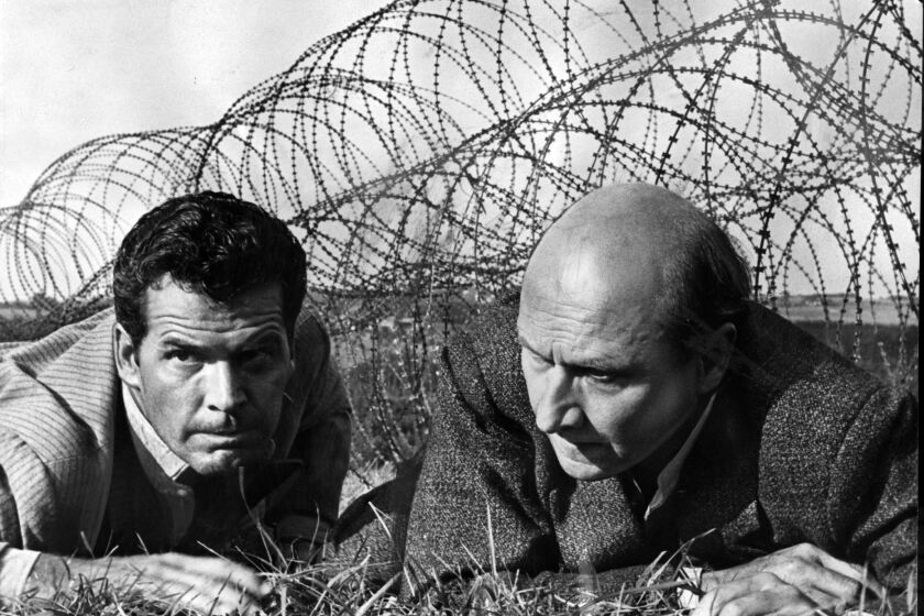 James Garner (left) and Donald Pleasance in a scene from the 1963 movie "The Great Escape" from United Artists. REVIVAL SEPT. 13, 2001