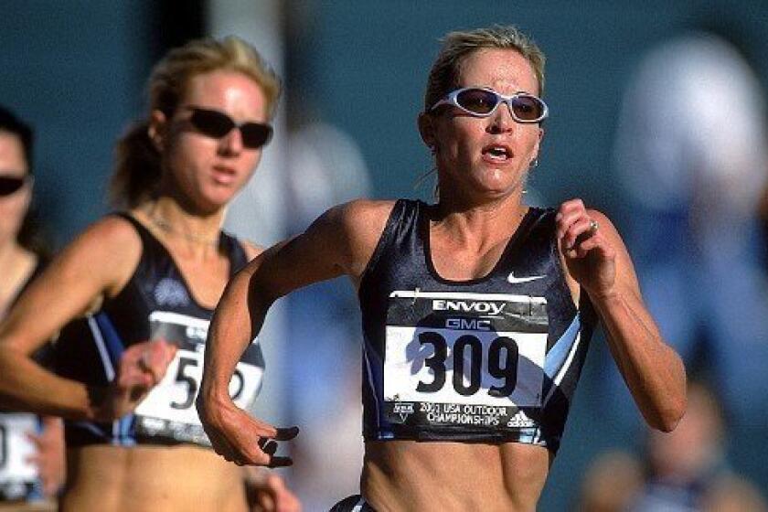 Suzy Favor Hamilton, right, runs in the 2002 U.S. Outdoor Track and Field Championships.