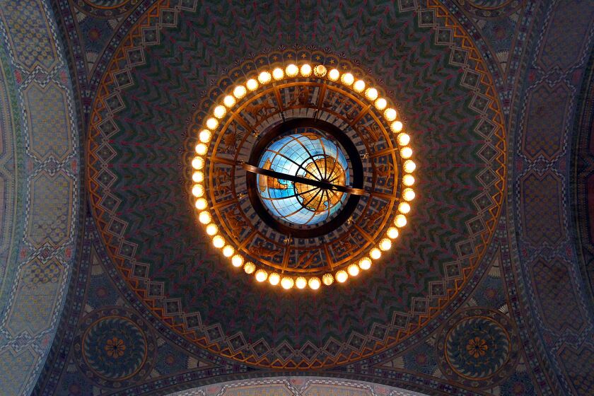 A globe chandelier dangles above the Lodrick M. Cook Rotunda at the Central Library.