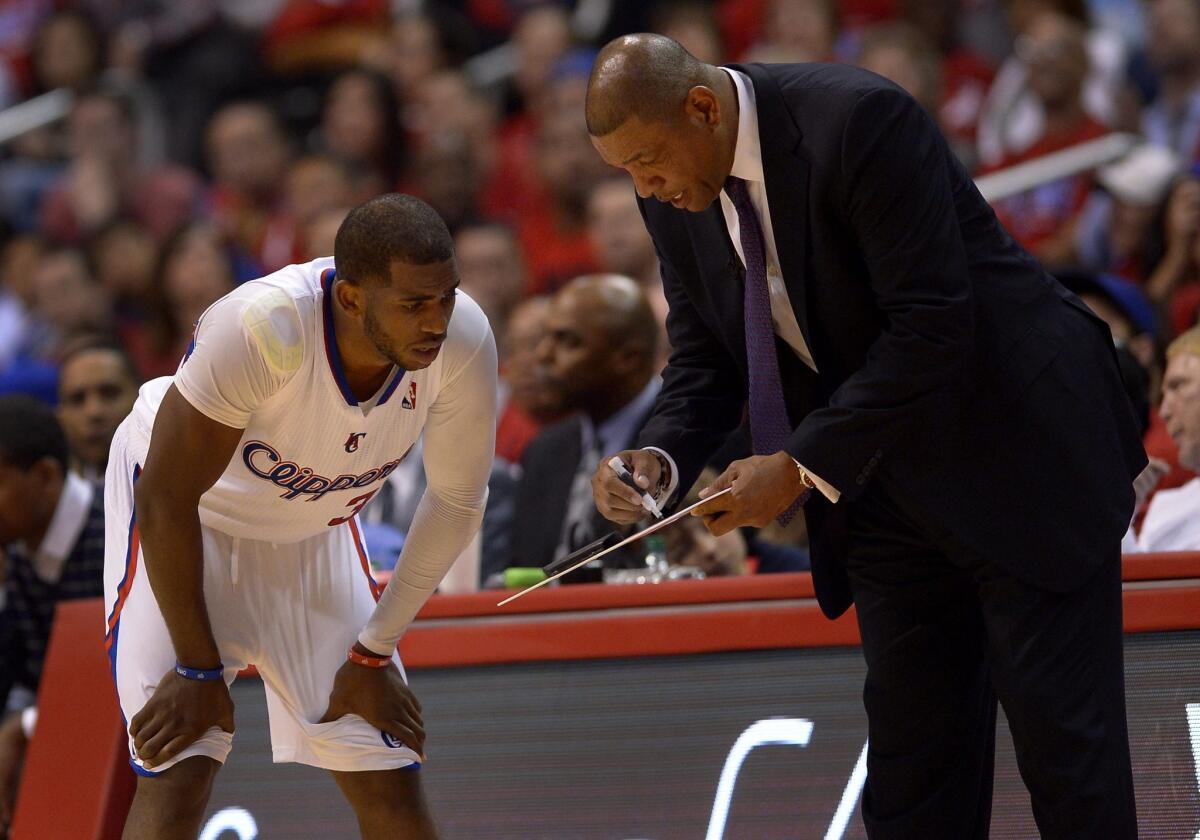 Clippers Coach Doc Rivers diagrams a play for Chris Paul during Game 2 of their first-round playoff series against the Golden State Warriors at Staples Center.