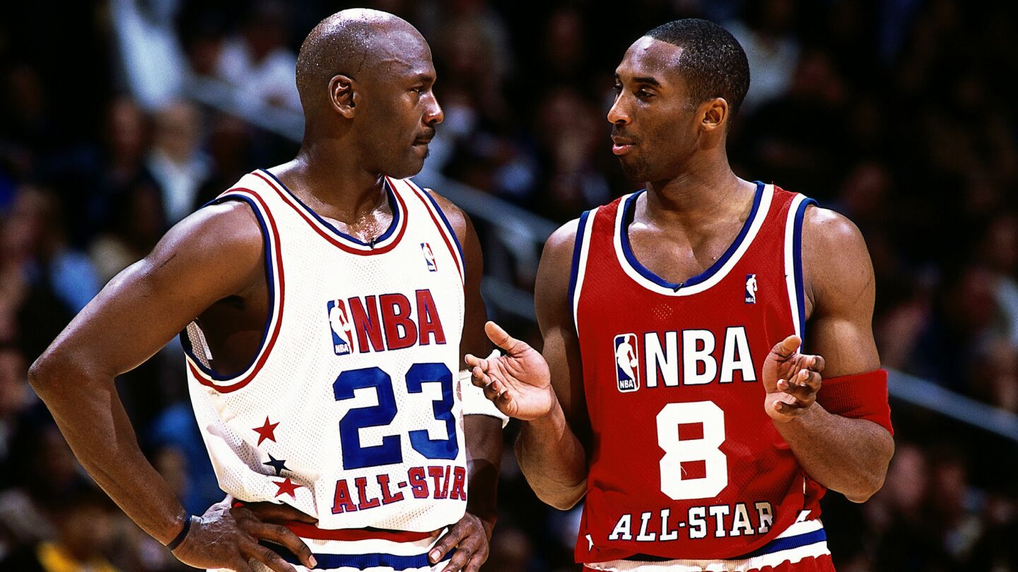 Kobe Bryant, right, speaks with Michael Jordan, then with the Washington Wizards, during the 2003 NBA All-Star Game in Atlanta.