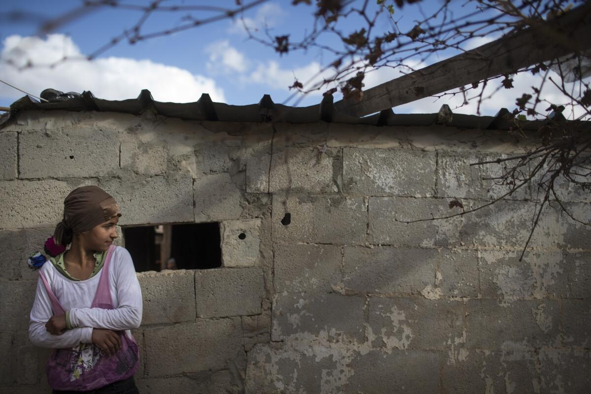 A Bedouin girl stands in her yard in Israel. Denying Bedouin Arabs full realization of the rights of citizenship has alienated them and pushed them away from membership in the Israeli polity.