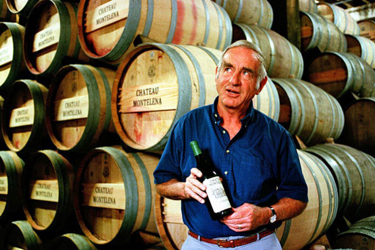 In this file photo, Jim Barrett, owner of Chateau Montelena, holds a bottle of the 1973 Chardonnay in Calistoga, Calif.