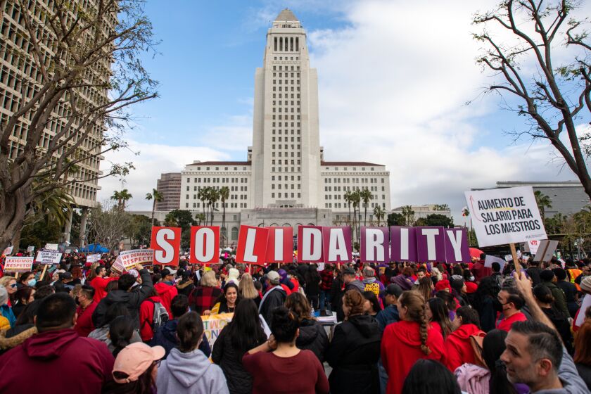  United Teachers of Los Angeles and SEIU 99 members hold a joint rally at Grand Park in a historic show of solidarity. 