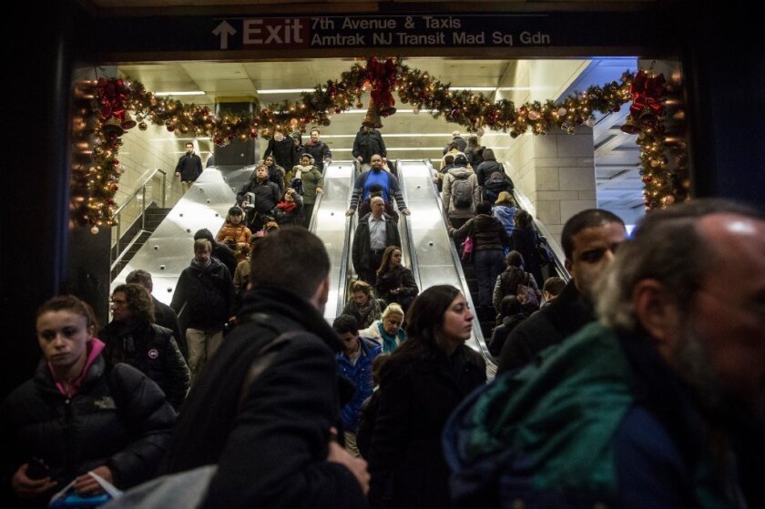 People crowd New York Penn Station during rush hour. Experts say addressing overpopulation is key to fighting climate change.