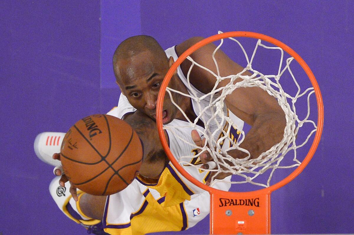 Lakers forward Kobe Bryant shoots a layup during the first half.