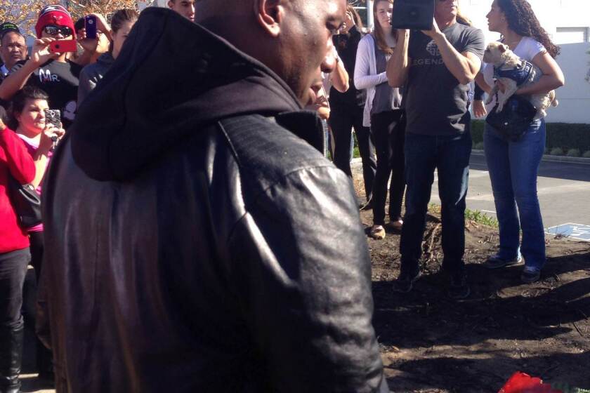 Actor Tyrese Gibson, Paul Walker's co-star on the "Fast and the Furious" films, pays his respects at the makeshift memorial site at the scene of the crash.