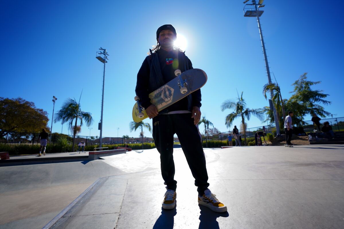 Brandon Turner, 39, pauses after warming up doing a few skateboard tricks at the Linda Vista Skate Park on Dec. 15.