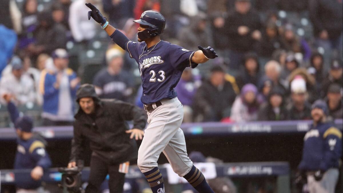 Milwaukee Brewers' Keon Broxton celebrates after hitting a solo homerun in the ninth inning of Game 3 of the National League Division Series against the Colorado Rockies on Sunday.
