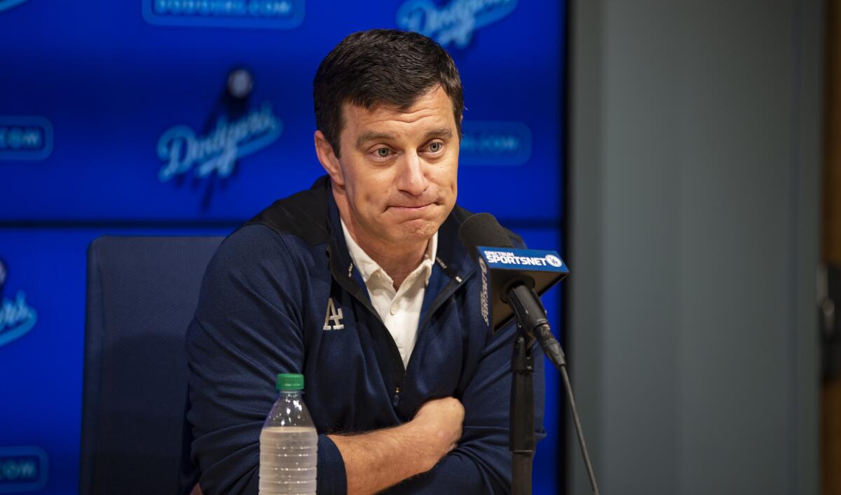 Dodgers' Andrew Friedman speaks to reporters.
