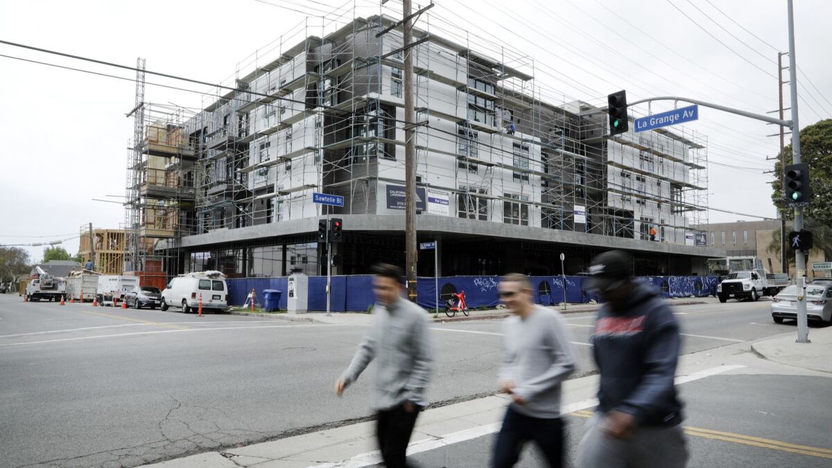 An apartment complex under construction on Sawtelle Boulevard in Los Angeles is being built under the city's Transit Oriented Communities program.