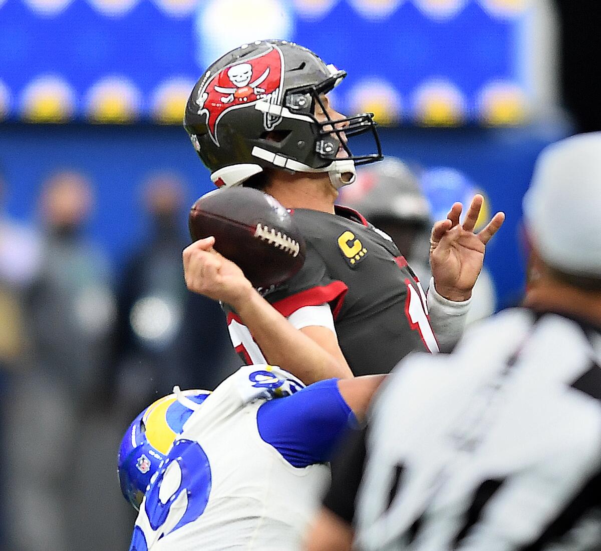 Rams defensive lineman Aaron Donald strips the football from Buccaneers quarterback Tom Brady in the second quarter.