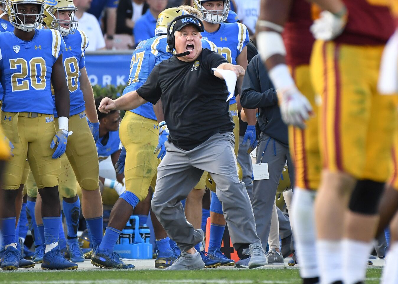 Bruins head coach Chip Kelly fires up his team against USC at the Rose Bowl on Saturday.