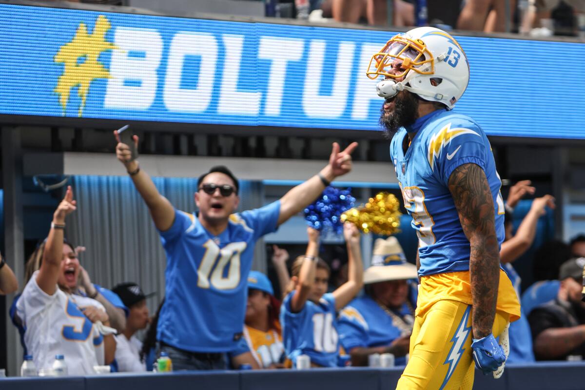 Chargers wide receiver Keenan Allen yells after catching a 42-yard pass.