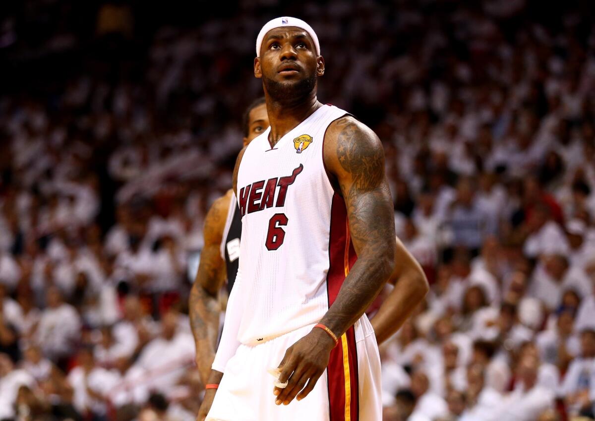 LeBron James looks up during the Heat's 21-point loss to the Spurs in Game 4 of the NBA finals. Miami is now down 3-1 as the series heads back to San Antonio.