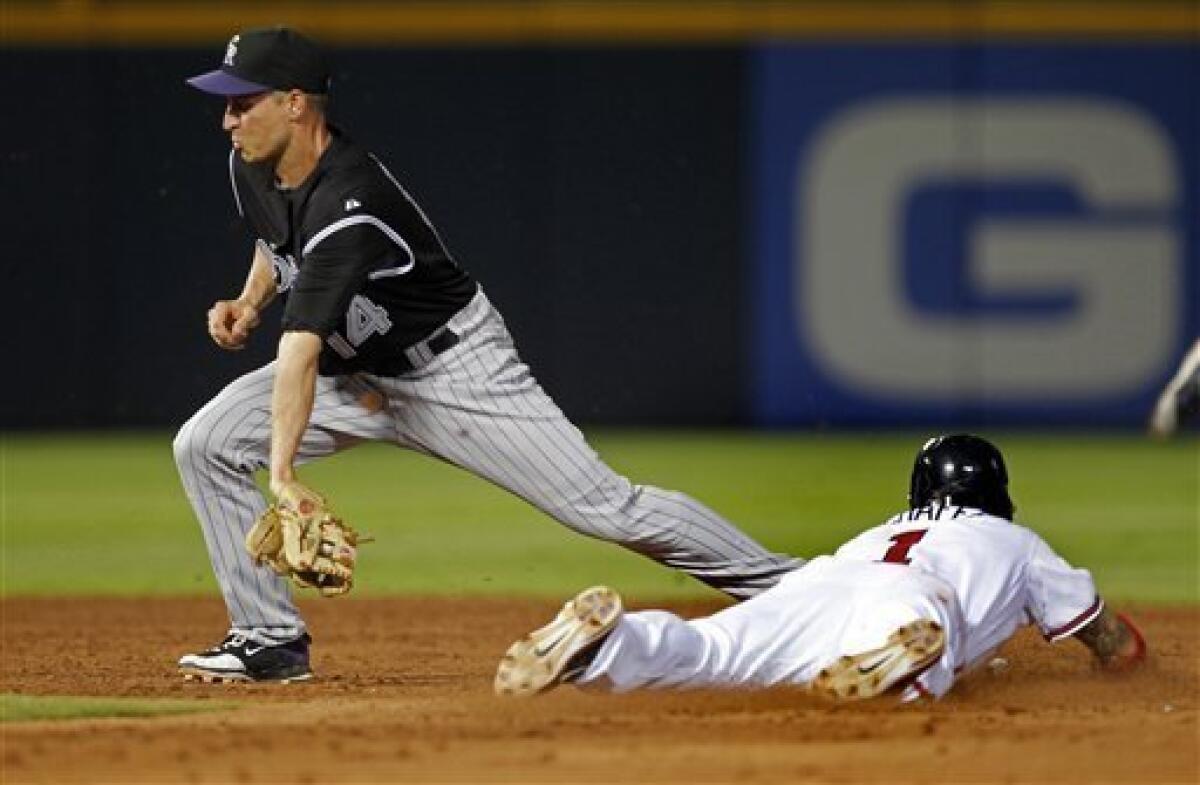 Atlanta Braves' Brian Jordan throws the ball toward the infield