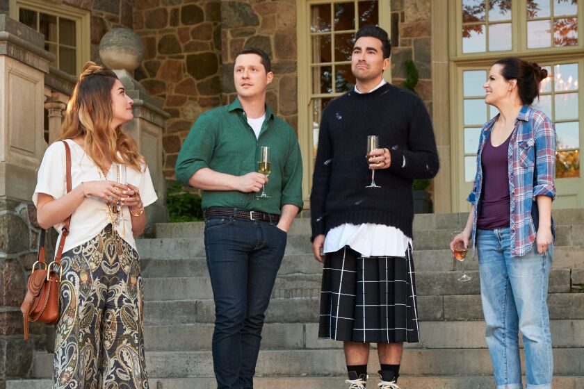 From left, Annie Murphy, Noah Reid, Dan Levy and Emily Hampshire in "Schitt's Creek," one of a spate of TV series to integrate queer themes into family comedy or drama.