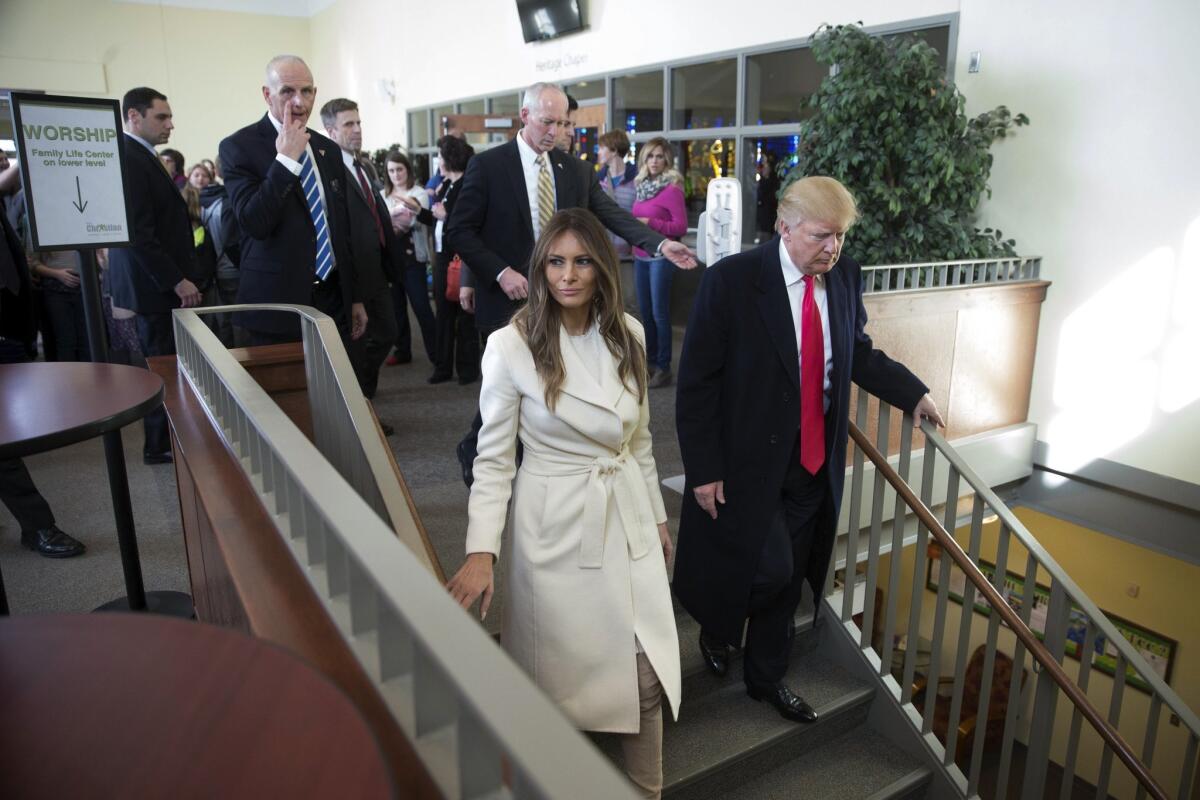 Donald Trump and his wife, Melania, arrive Sunday at First Christian Church in Council Bluffs, Iowa.