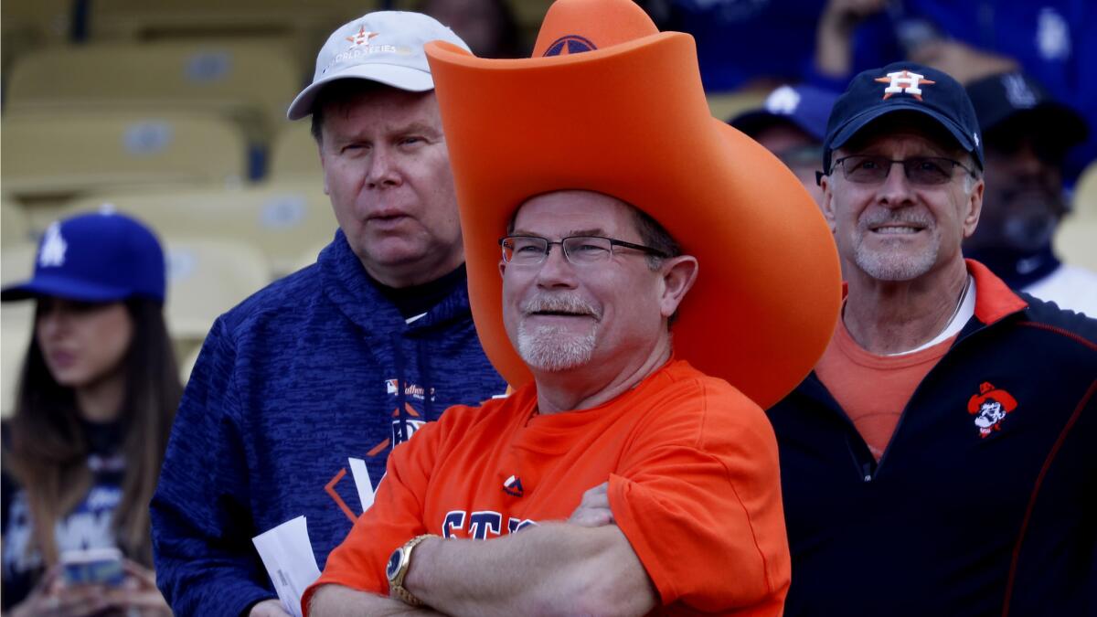 Astros fans watch their team warm up before the start of Game 7.