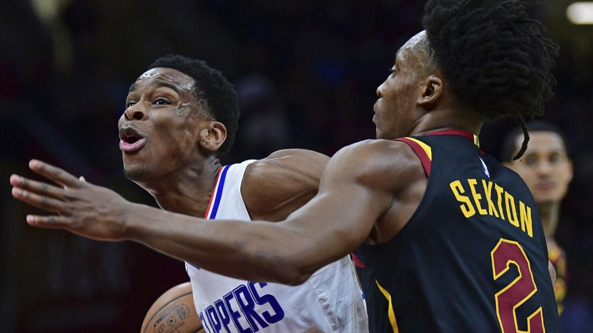 The Clippers' Shai Gilgeous-Alexander drives against the Cleveland Cavaliers' Collin Sexton in the second half.