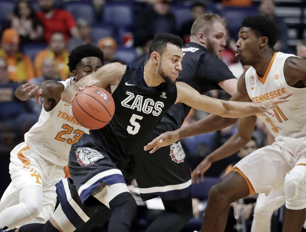 Gonzaga guard Nigel Williams-Goss (5) drives against Tennessee defenders Jordan Bowden (23) and Kyle Alexander (11) in the first half on Dec. 18.