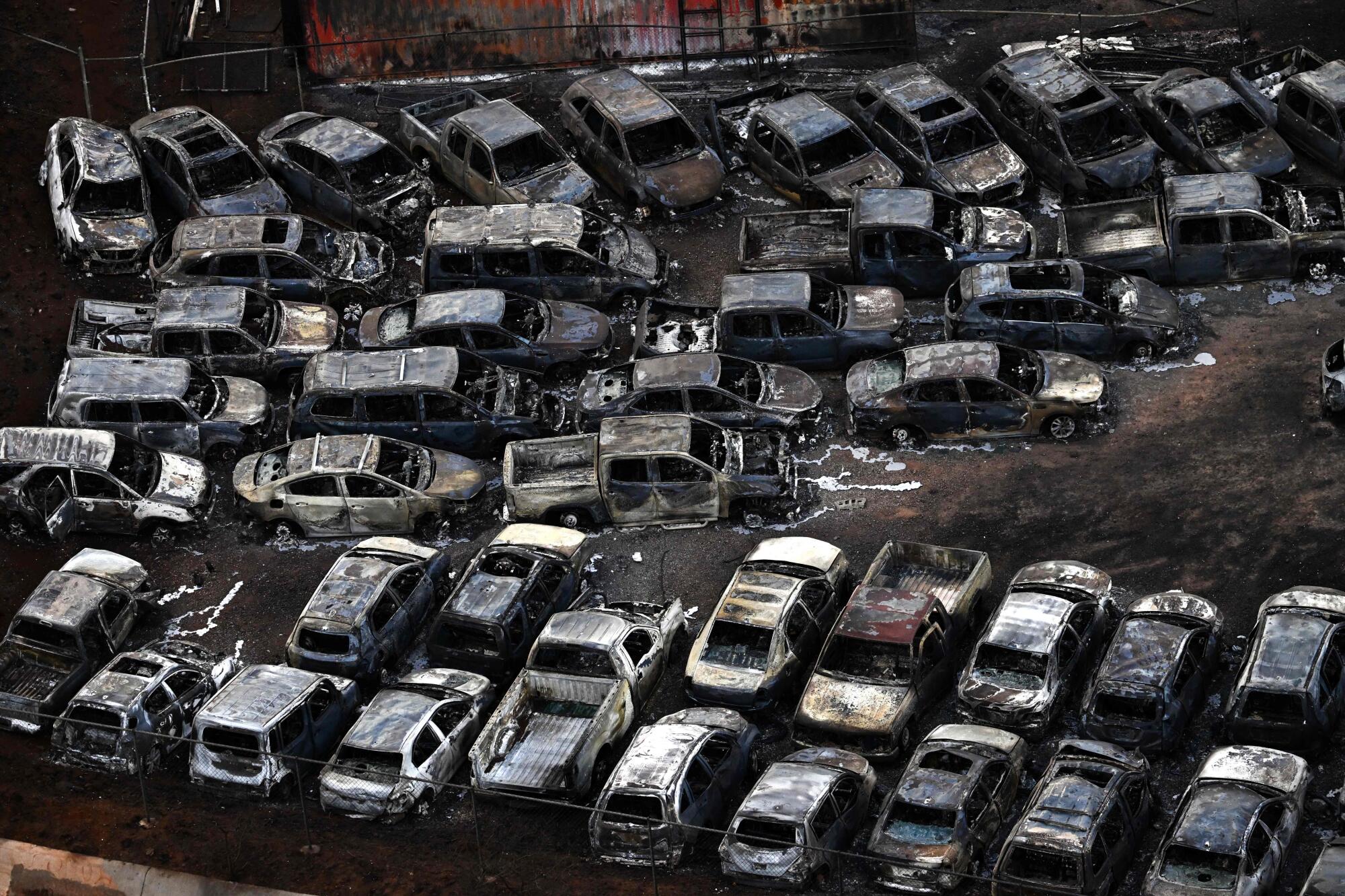 An aerial image shows destroyed cars in the aftermath of wildfires.