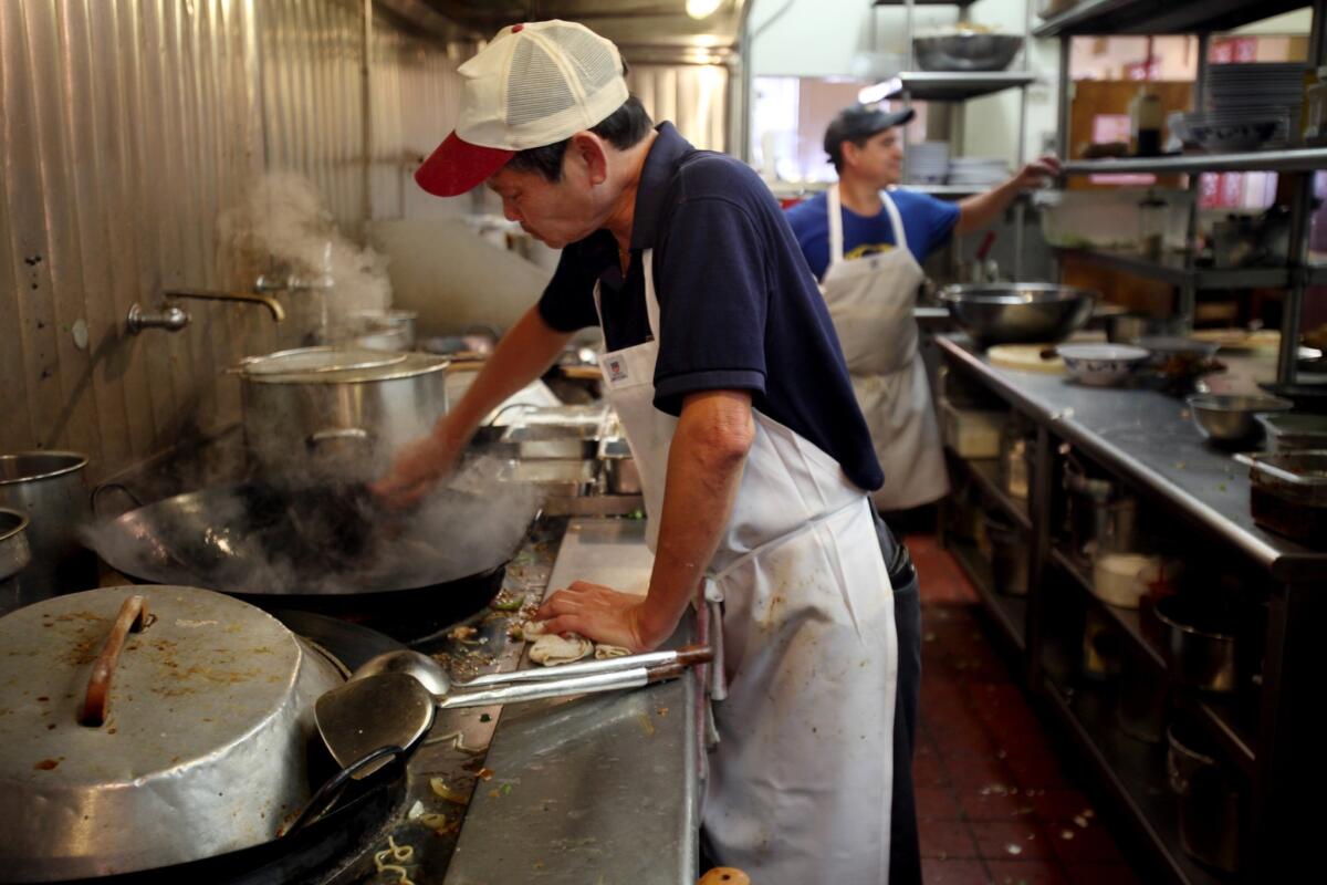 Chef Xing Hoang works in Paul's Kitchen, which turns out heaps of egg foo yong, chop suey and chasu barbecue pork, all swimming in a deep brown gravy. The food is a throwback to a different era in cuisine -- culturally Chinese but unapologetically American.