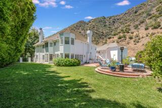 Tucked among the canyons, the 10,000-square-foot home comes with an indoor basketball court and locker room.