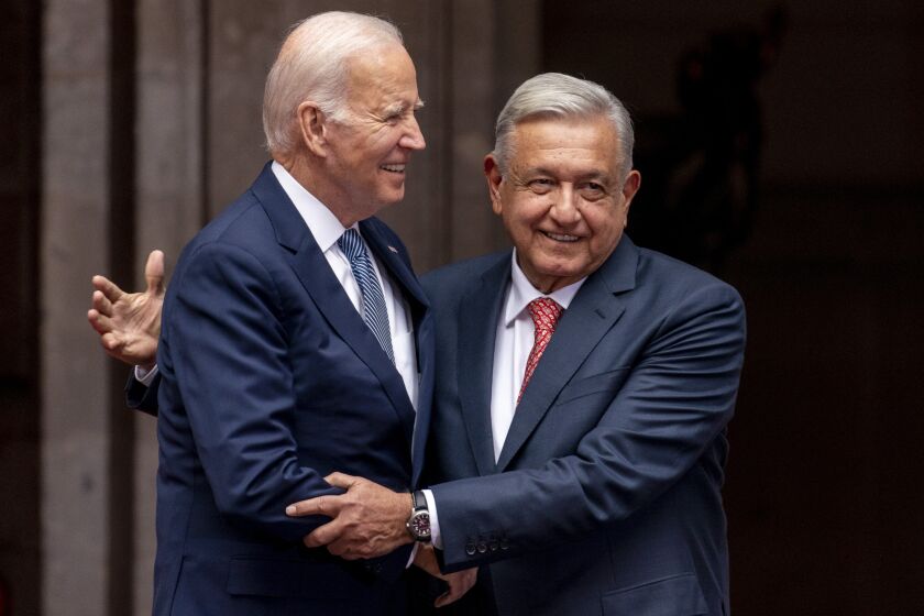 President Joe Biden is greeted by Mexican President Andres Manuel Lopez Obrador as he arrives at the National Palace in Mexico City, Mexico, Monday, Jan. 9, 2023. (AP Photo/Andrew Harnik)
