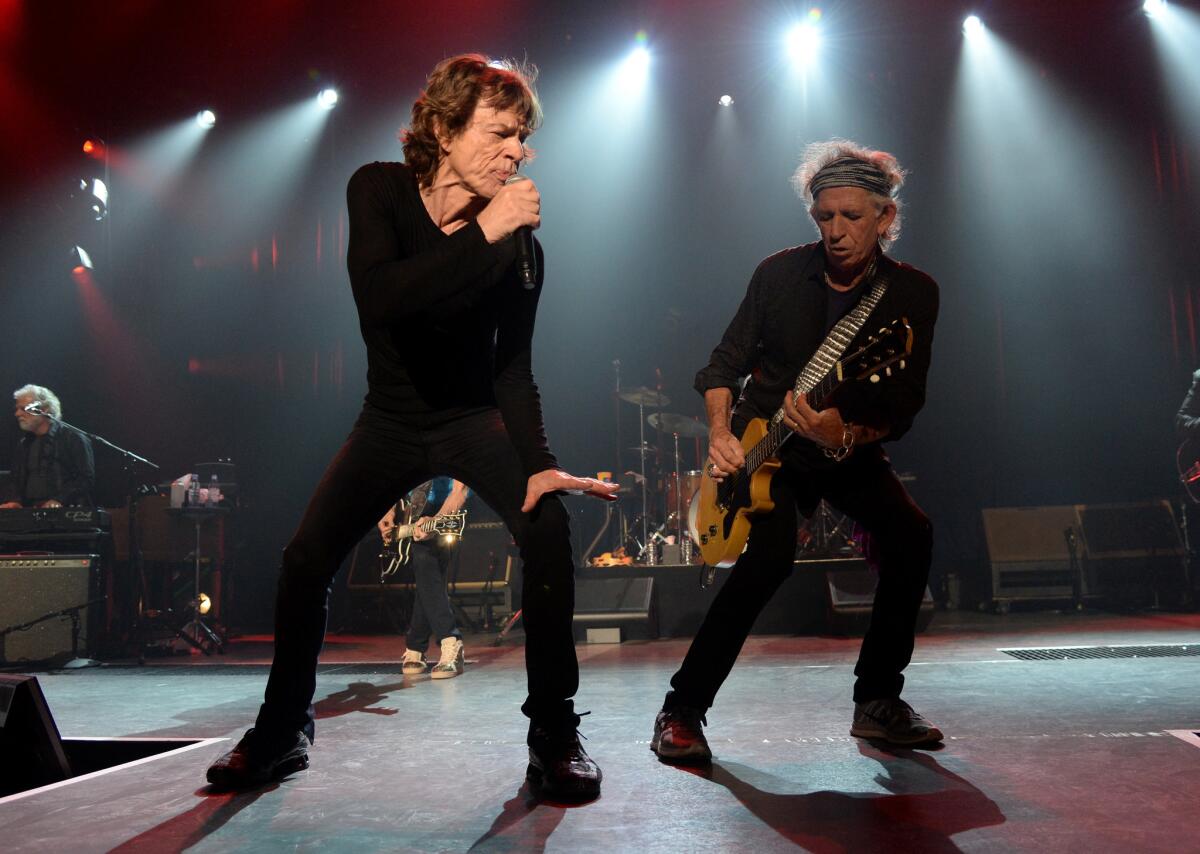 Mick Jagger, left, and Keith Richards perform during The Rolling Stones Los Angeles Club Show at The Fonda Theatre on May 20, 2015, in Los Angeles, California. The Stones' Zip Code Tour is the top-grossing tour in North America during the first half of the year.