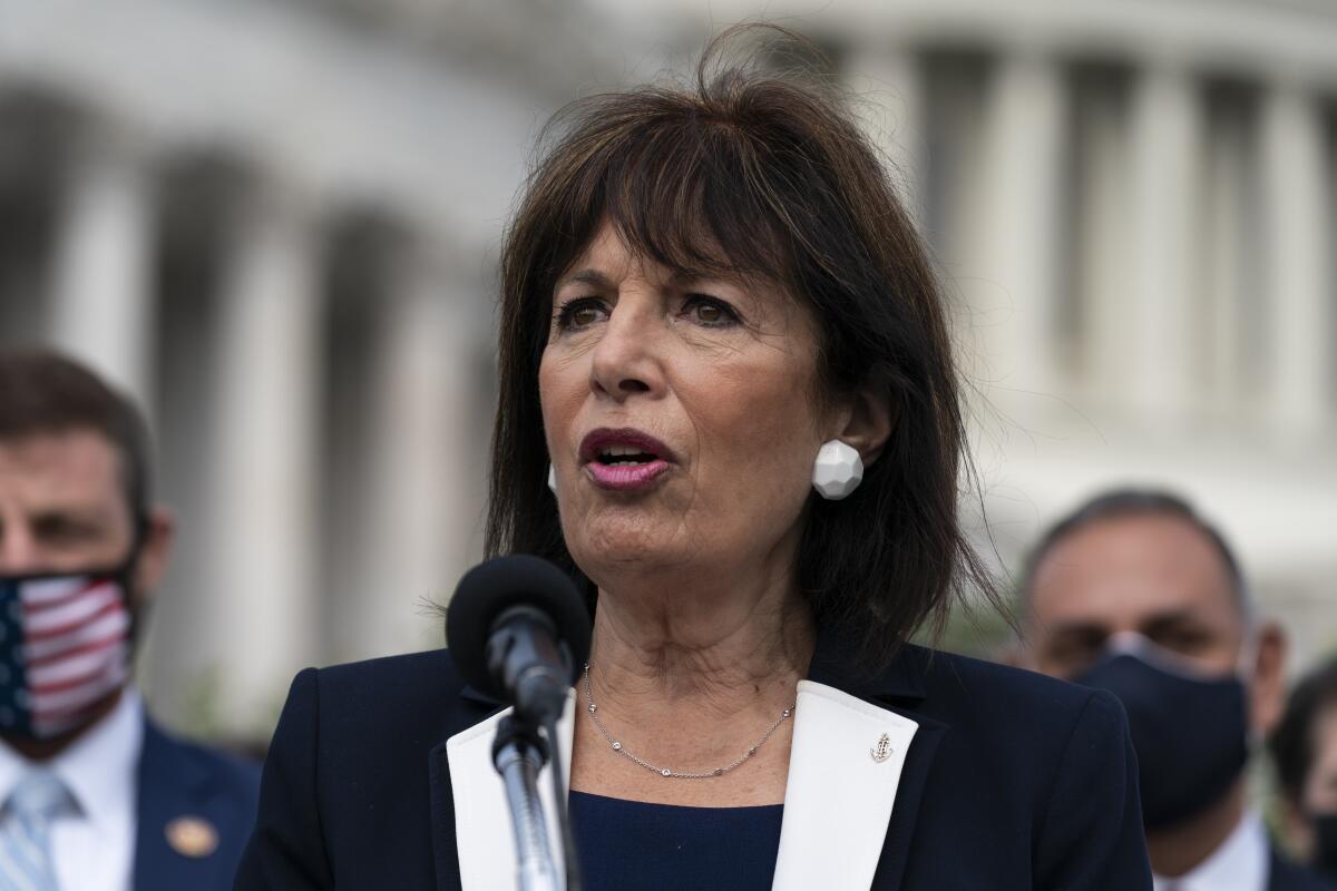 California Rep. Jackie Speier pictured from the shoulders up, speaking into a microphone outside the Capitol