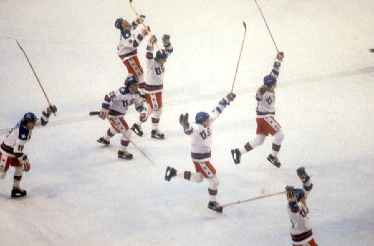 U.S. hockey players celebrate after defeating the Soviet Union in the semifinals of the 1980 Winter Olympics in Lake Placid, N.Y.