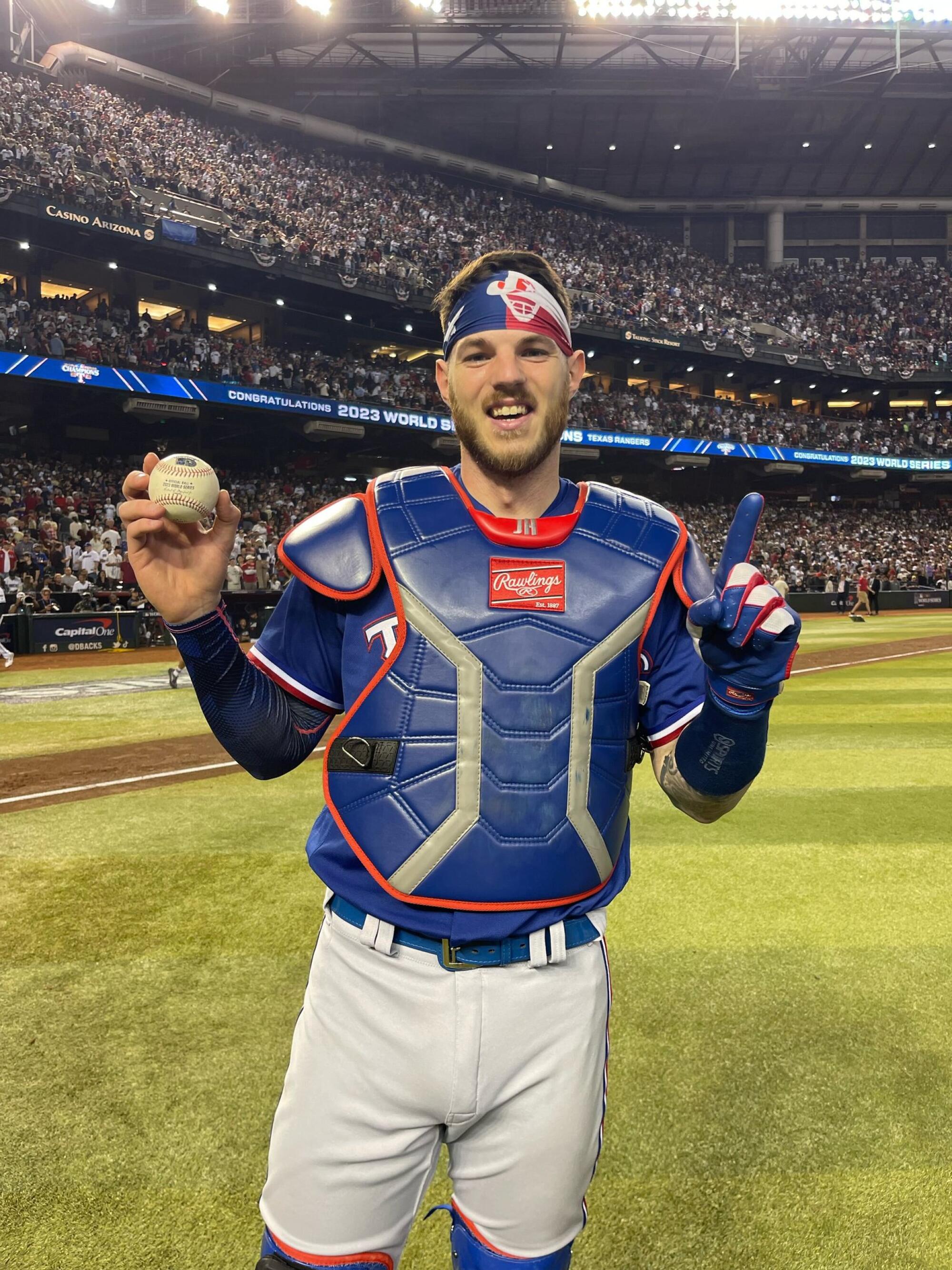 Rangers catcher Jonah Heim with the authenticated baseball that was the last out of the 2023 World Series. 