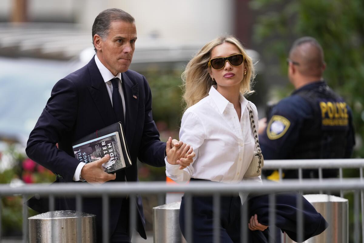 Hunter Biden, left, arrives to federal court with his wife, Melissa Cohen Biden.